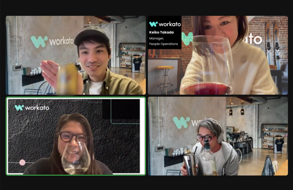 An image of four Workato colleagues based in Japan drinking wine together over Zoom